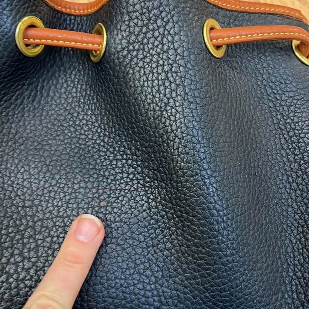 Dooney & Bourke tassel bucket bag blue pebbled leather tan accent gold hardware